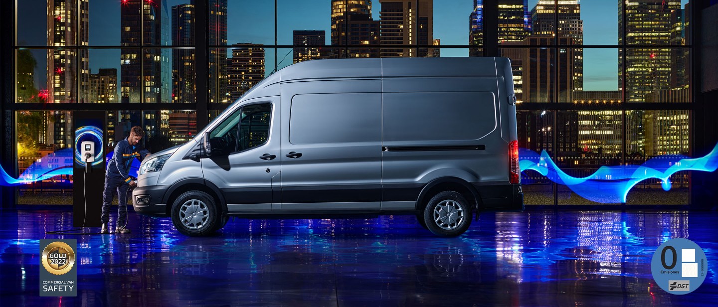 New E-Transit side view with the backdrop of city in night with blue electric lights New E-Transit side view with the backdrop of city in night with blue electric lights