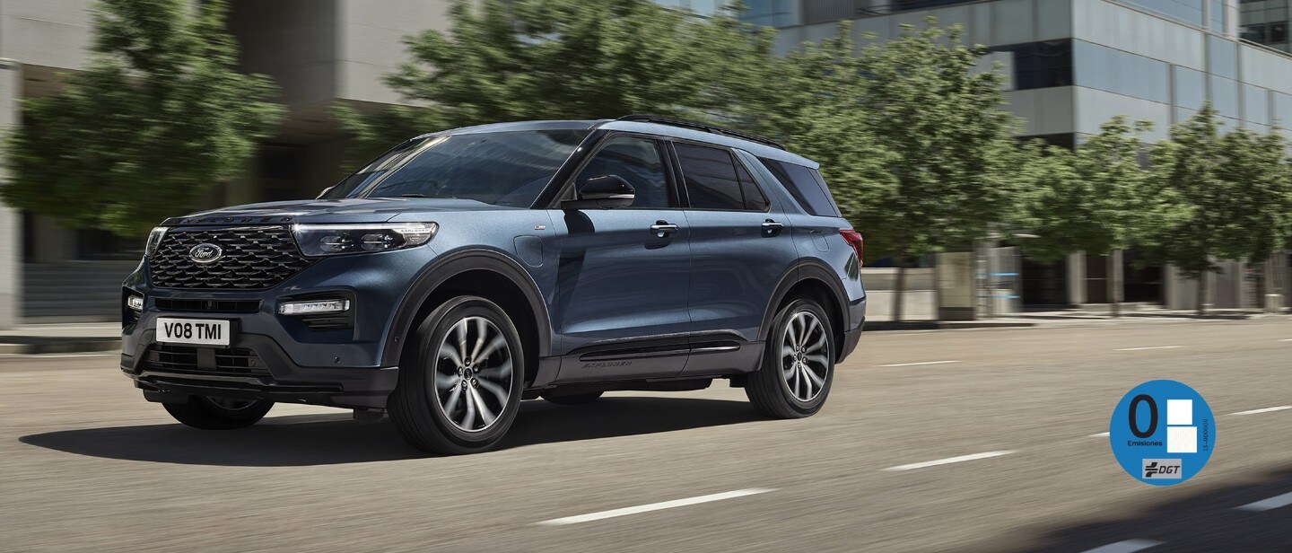 New metallic blue Ford Explorer PHEV in motion driving through city