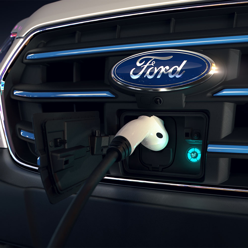 Cargador eléctrico en una Ford E-Transit con parrilla delantera y logotipo Ford. 