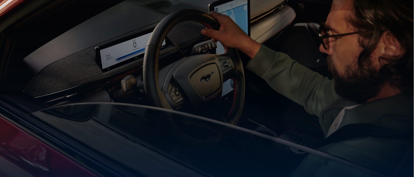 Interior view of someone driving a Ford car