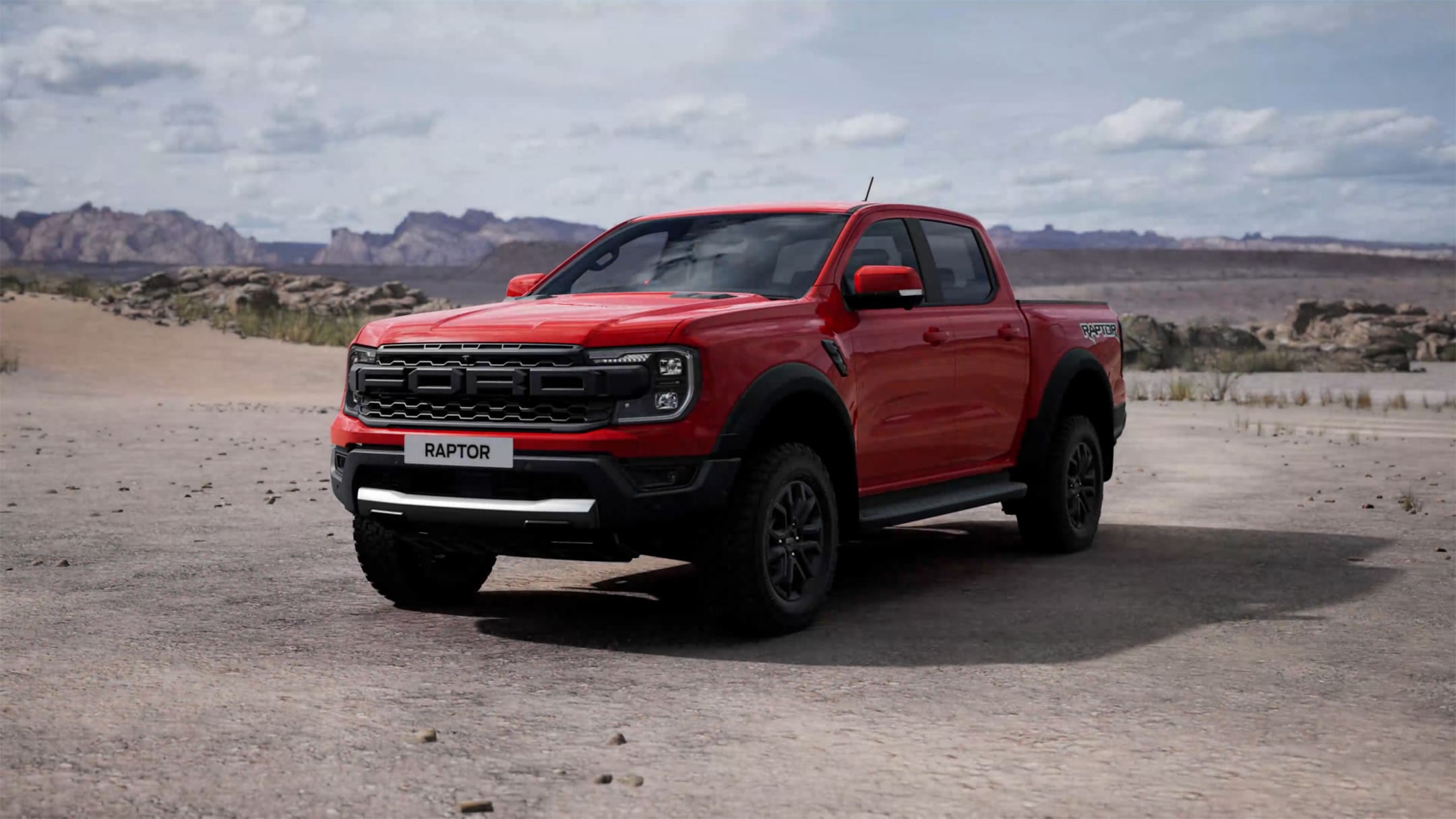 3 quarter view of the Ford Ranger Raptor parked against a desert background.