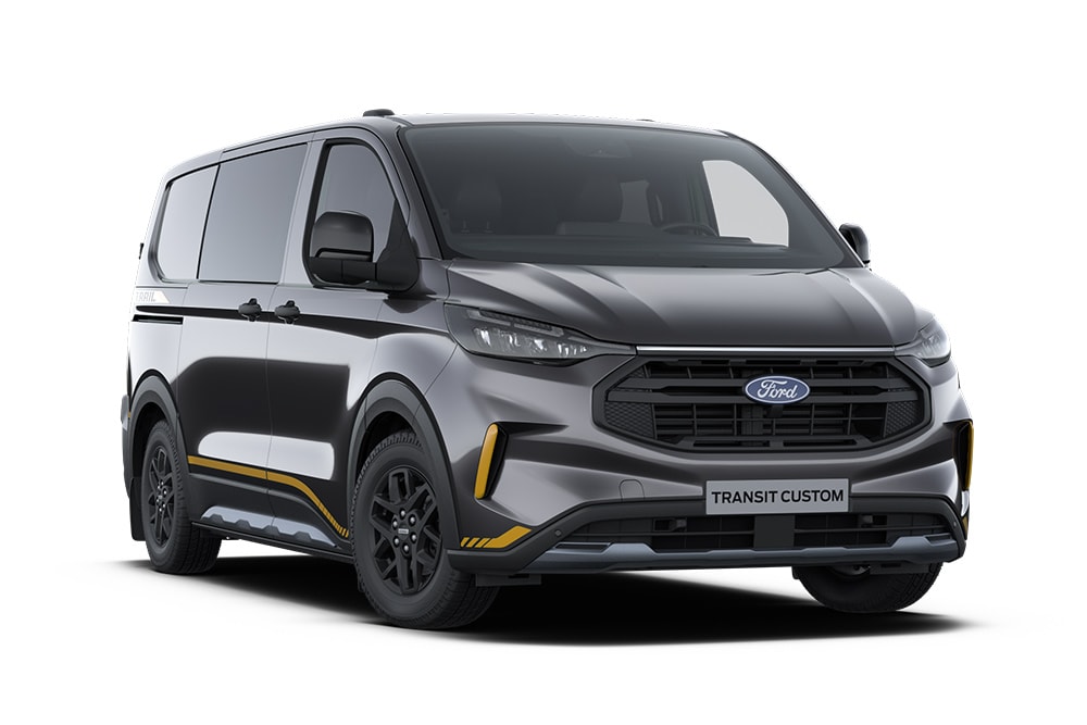 Furgoneta Trail Ford Transit Custom gris oscuro con doble cabina con detalles dorados.