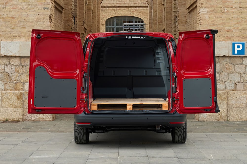 Rear view of Ford Transit Connect, with open rear doors, loaded with construction materials.