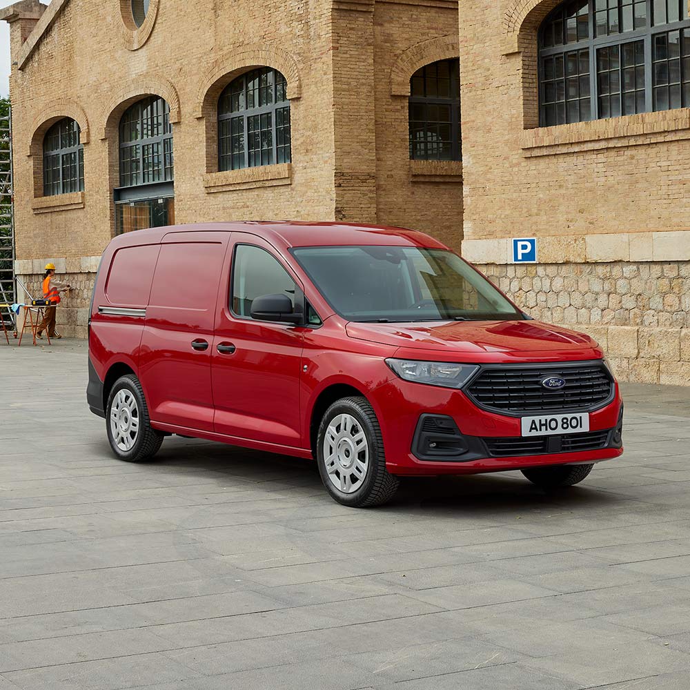Ford Transit Connect Trend in Lava Red, showing front grille and automatic headlights.