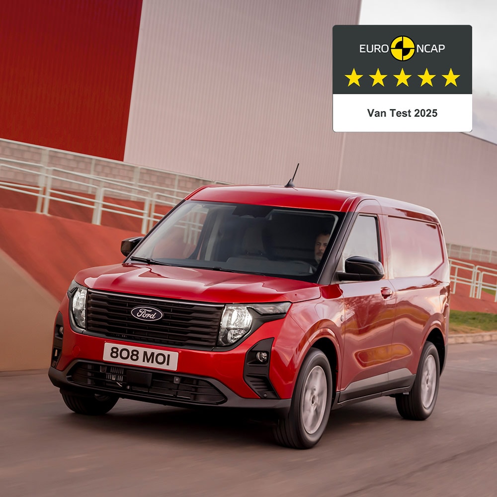 New red Ford Transit Courier Van driving