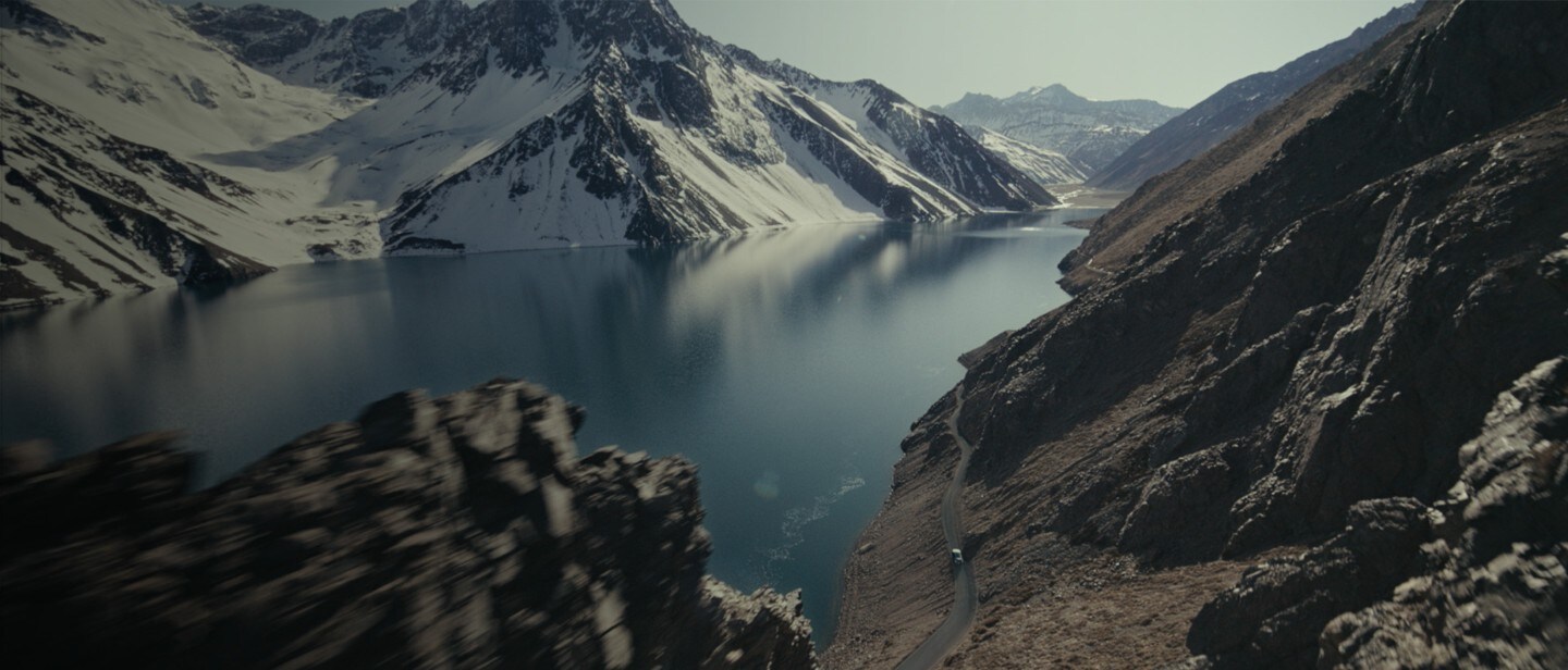 Nordic landscape with snowy mountains and a lake