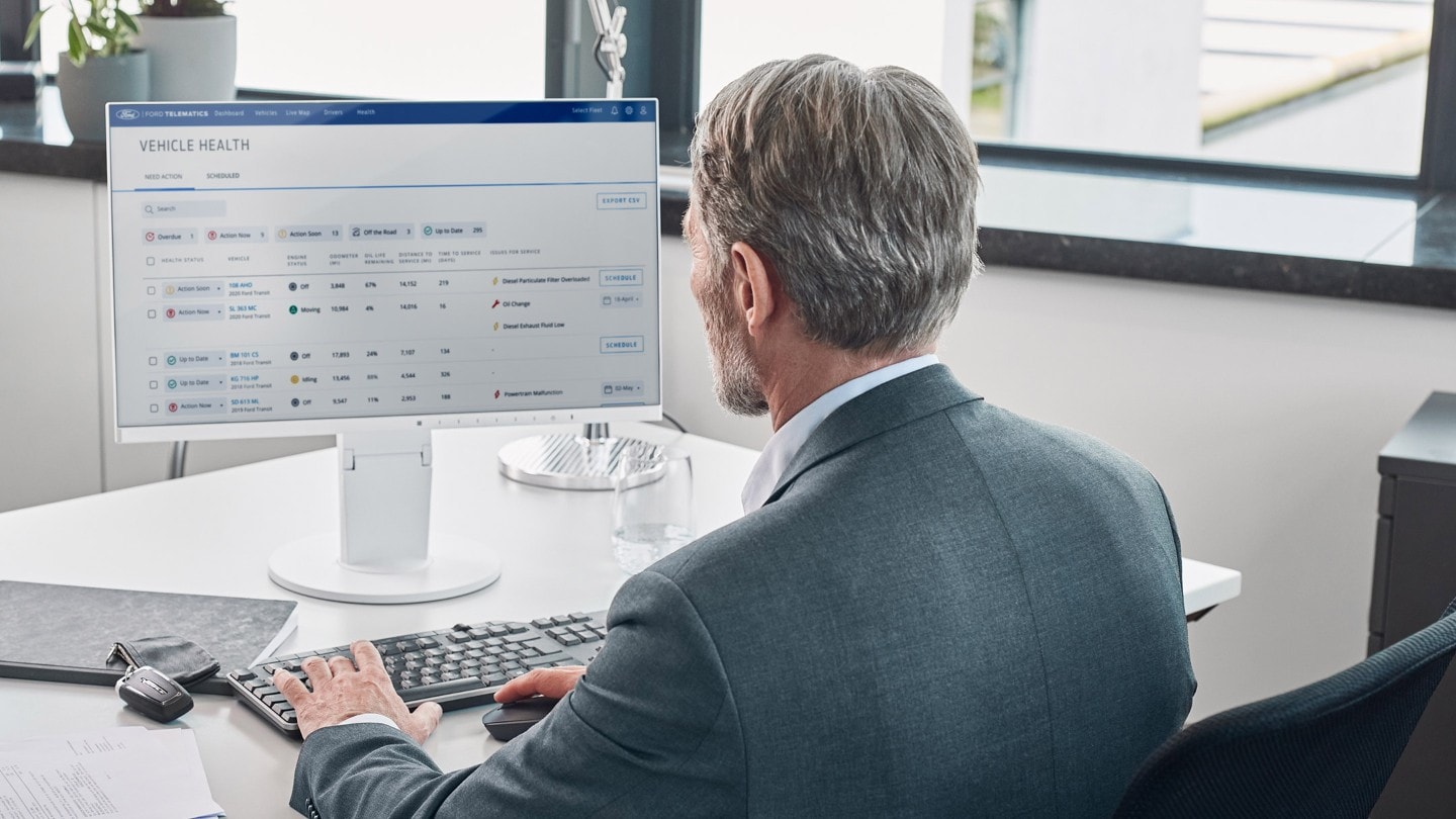 Man sitting behind computer in office