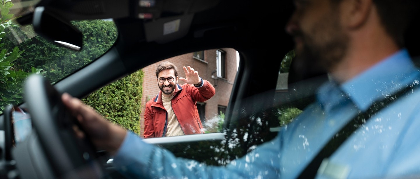 Ford service engineer, waring face-covering in vehicle