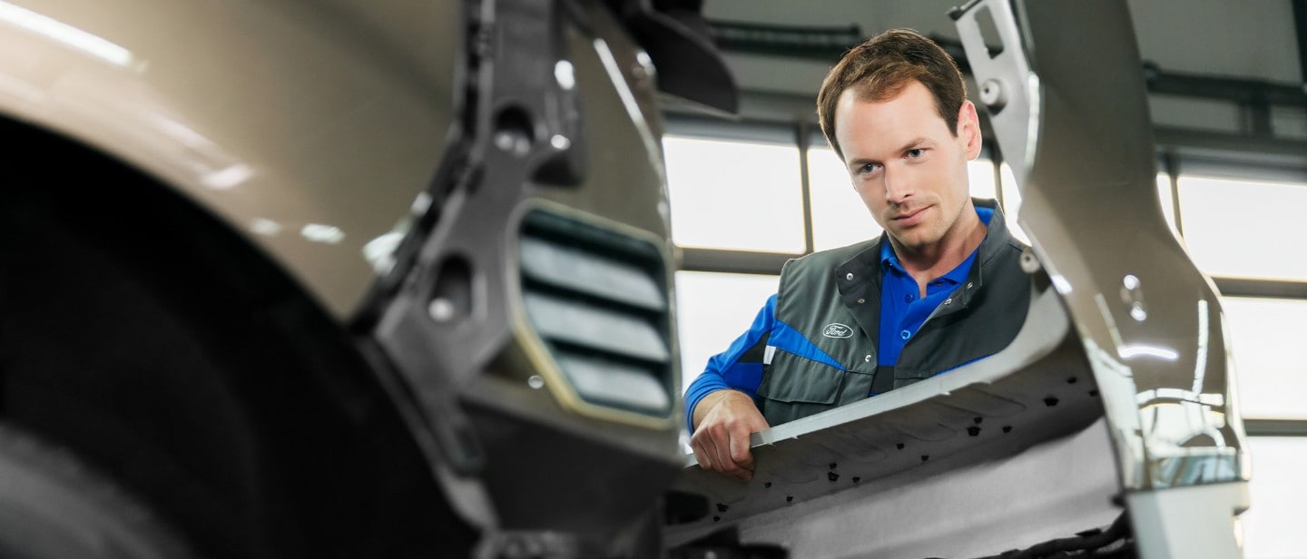 Ford service repair engineer, replacing front bumper